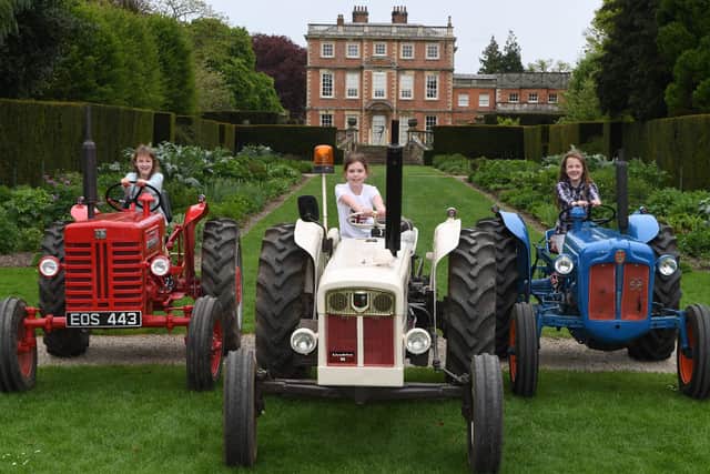 Newby Hall Tractor Festival - Pictured from left on vintage tractors at Newby Hall are 11-year-old twin Scarlet Goldsworthy, 9-year-old Lexi Arnett and 11-year-old twin Kowenna Goldsworthy. Picture Gerard Binks