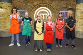 Abi, third from left in the yellow apron, with fellow contestants Khinley, Ben, Tatjana, Yogita and Max. Photo: BBC/Shine TV