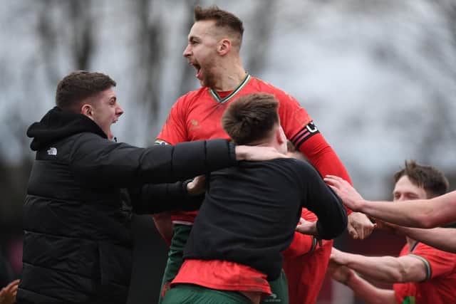 Captain Dan McDaid celebrates with his Harrogate Railway team-mates and substitutes after netting a 97th-minute winner against Horbury Town.