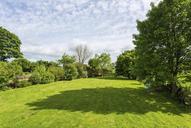 Land to the east of the house extends to over four acres, with some woodland.