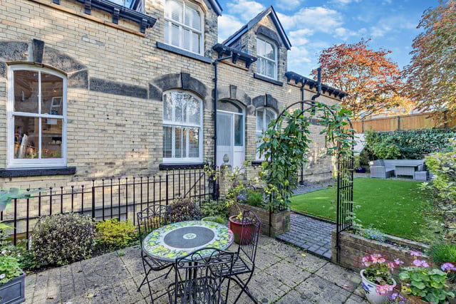 Lawned and seating areas within the enclosed rear garden.