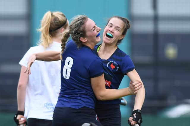 Goal-scorer Holly Oldham, left, is congratulated by captain Lucy Wood during Harrogate Hockey Club Ladies 1st XI's 2-2 draw with Alderley Edge. Pictures: Gerard Binks