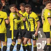 Harrogate Town players celebrate taking a 19th-minute lead against Accrington Stanley at Wetherby Road. Pictures: Matt Kirkham