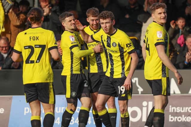 Harrogate Town players celebrate taking a 19th-minute lead against Accrington Stanley at Wetherby Road. Pictures: Matt Kirkham