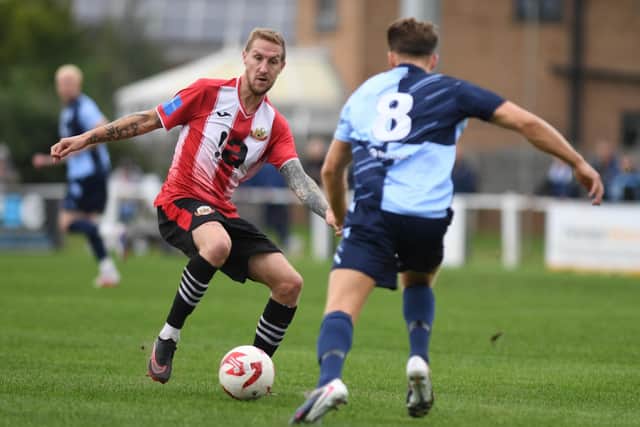 Slater Barnes looks for a way through the Bishop Auckland defence at Manse Lane.