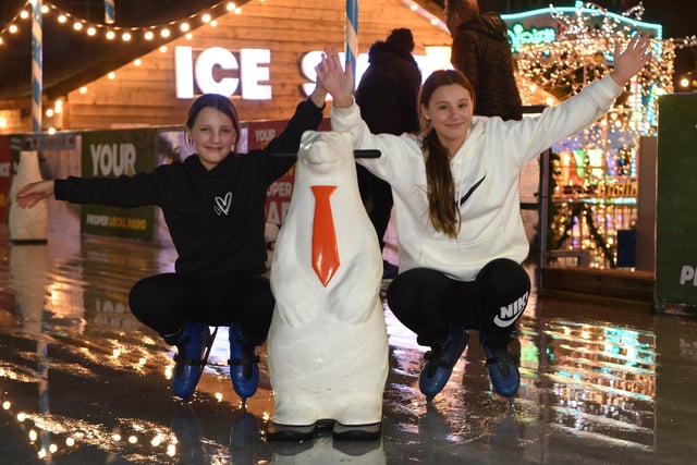 Alyssia Drane (aged eleven) and Imogen Thompson (aged eleven) enjoying an evening on the ice with their polar bear