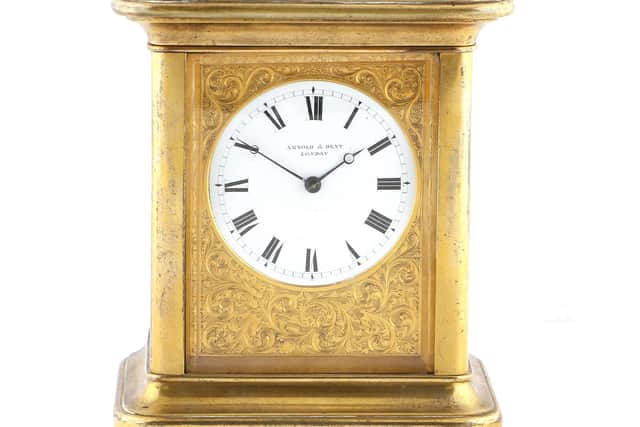 Upper section of Rare Brass Striking and Repeating Giant Carriage Clock, signed Arnold & Dent, London, circa 1835, that old for £8,500.