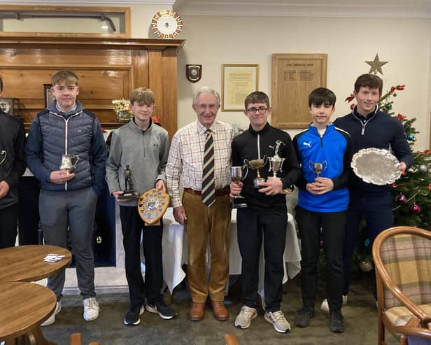 Harrogate GC president, Ian Glover, centre, and professional, Lewis Harrison, right, with the club's 2022 juniors prize-winners. Pictures: Submitted