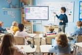 Teacher utilising technology in the classroom