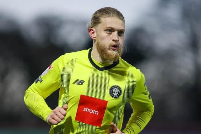 Harrogate Town striker Luke Armstrong celebrates the first of his two goals against Rochdale.