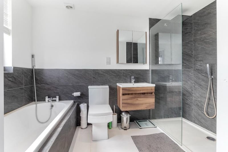A contemporary style bathroom with suite including both bath and walk-in shower unit.
For more details, call Hopkinsons tel. 01423 501201.