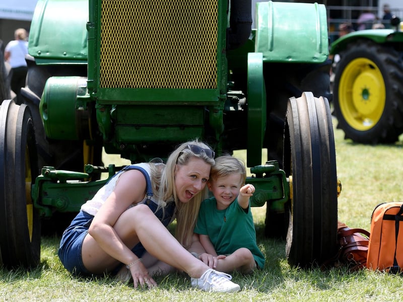 Ted King (aged four) watching the tractors with his mum Gemma King in the sunshine at Newby Hall