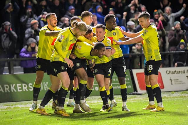 Harrogate Town's players celebrate their stoppage-time winner against Grimsby on Boxing Day. Picture: Ben Roberts/ProSportsImages