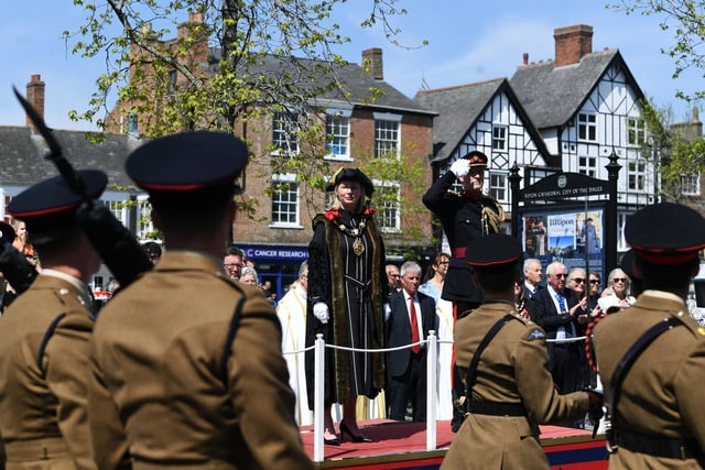 The new Mayor watches the parade pass by