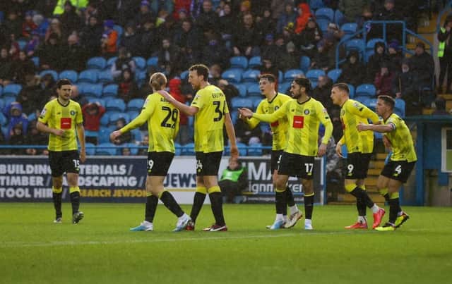 Harrogate Town celebrate after Paul Huntington's own goal handed them a late 1-0 lead during Saturday's League Two clash at Carlisle United. Pictures: Matt Kirkham