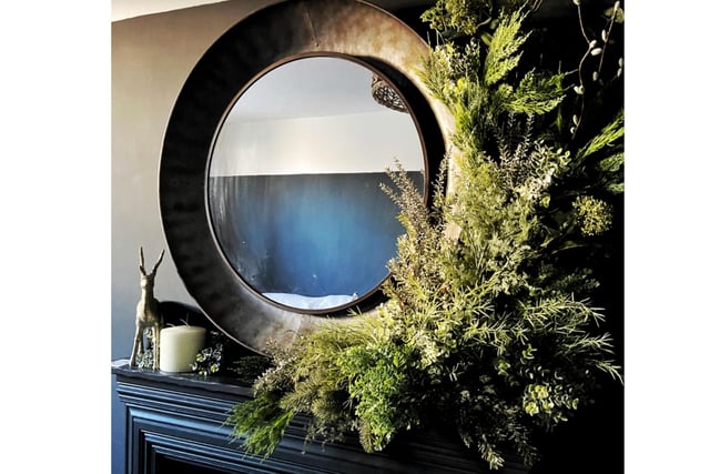 This bold mirror and wreath design is a stunning feature to any fireplace. - For those looking for a stylist in 2024, please contact Miss Franklin and get your consultation.