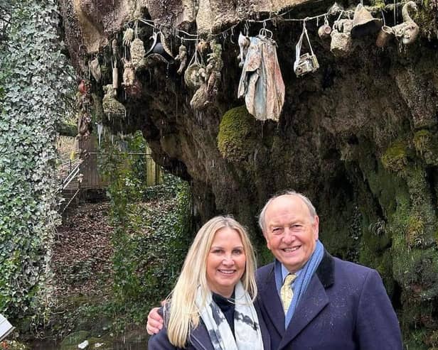 TV show in Knaresborough - Pictured in front of the Petrifying Well is Mother Shipton's Cave owner, Fiona Martin, alongside Bargain Hunt presenter Charlie Ross. (Picture contributed)