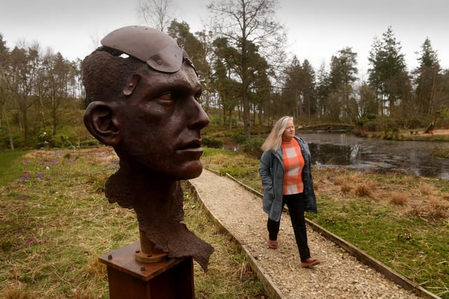 Sasha Jackson-Brown pictured with the sculpture called 'Angel of the Trench' by Laura and Paul Carey