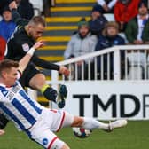 Harrogate Town midfielder Alex Pattison takes aim at the Hartlepool United goal during Sunday's 3-3 draw at Victoria Park. Pictures: Matt Kirkham