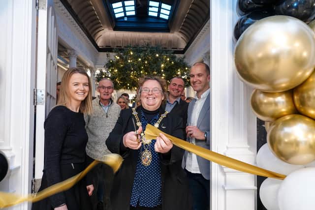 Grand reopening - The Mayor of Harrogate, Coun Victoria Oldham, performs the ribbon cutting ceremony with . Windsor House Building Manager Karen Winspear.