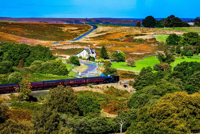 Steam locomotives LNER Q6 No. 63395 (2238) powering along the North Yorkshire Moors Railway (NYMR) in the stunning Autumn landscape between Pickering towards to Whitby.