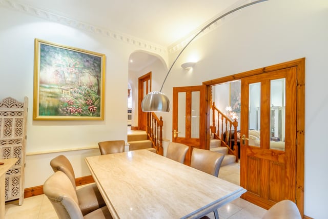 The lounge and dining room both display decorative coving.