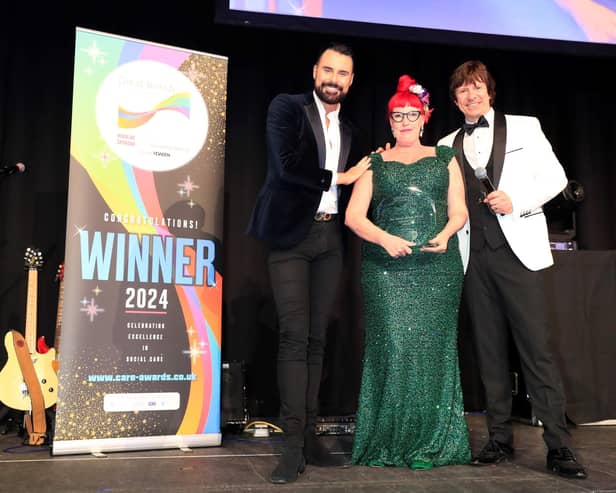 Harrogate's Karen Crampton receives the Palliative Care Award from Rylan Clark and Steve Walls  at the Great British Care Awards. (Picture contributed)