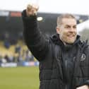 Harrogate Town manager Simon Weaver celebrates with the home fans after his team beat Fleetwood 3-1 at Wetherby Road to secure their Football League status. Pictures: Paul Thompson/ProSportsImages