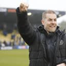 Harrogate Town manager Simon Weaver celebrates with the home fans after his team beat Fleetwood 3-1 at Wetherby Road to secure their Football League status. Pictures: Paul Thompson/ProSportsImages