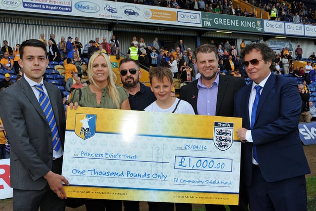 John Radford and Jack Thomas present a £1,000 cheque from the FA Community Shield fund to Amanda, Robert and Harvey Jones from the Princess Evie's Trust with trustee Shaun Massey.