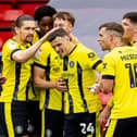 Josh March is congratulated by his Harrogate Town team-mates after netting a 22nd-minute equaliser against Walsall. Pictures: Manjit Narotra/ProSportsImages