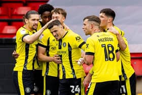 Josh March is congratulated by his Harrogate Town team-mates after netting a 22nd-minute equaliser against Walsall. Pictures: Manjit Narotra/ProSportsImages