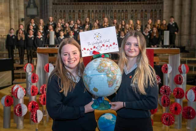 Pictured: Wensleydale School students Millie Gilbey and Jessica Arnott with their school’s globe.