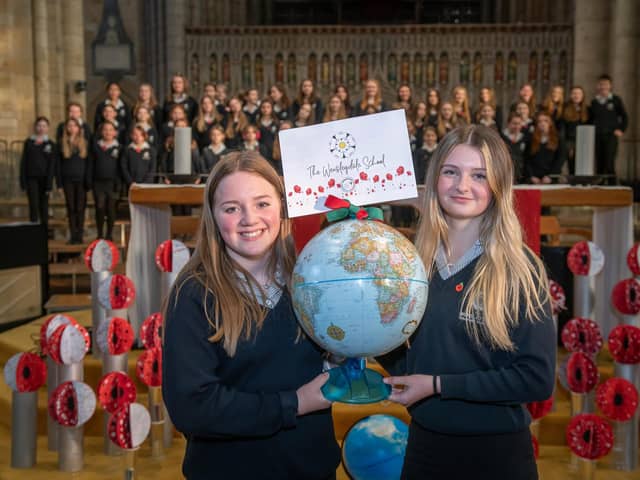 Pictured: Wensleydale School students Millie Gilbey and Jessica Arnott with their school’s globe.