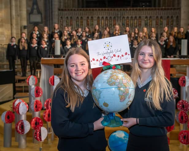 Pictured: Wensleydale School students Millie Gilbey and Jessica Arnott with their school’s globe.