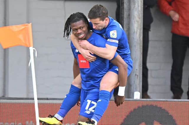 Sam Folarin is congratulated by Harrogate Town captain Josh Falkingham after netting his side's fifth-minute equaliser at Newport County. Pictures: Harrogate Town AFC