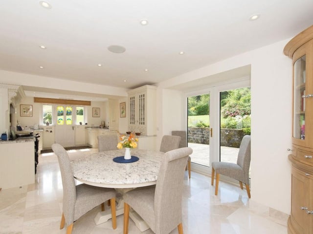 The open-plan kitchen and breakfast area lead onto a patio and terrace bringing in light and opening onto to landscape.