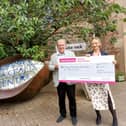 Yorkshire Young Achievers Foundation grant for Henshaws Arts and Crafts Centre in Knaresborough which works with disabled people - Here Foundation Trustee Martin Gerrard presents a cheque to Flora Simpson, Senior Fundraiser at Henshaws. (Picture contributed)