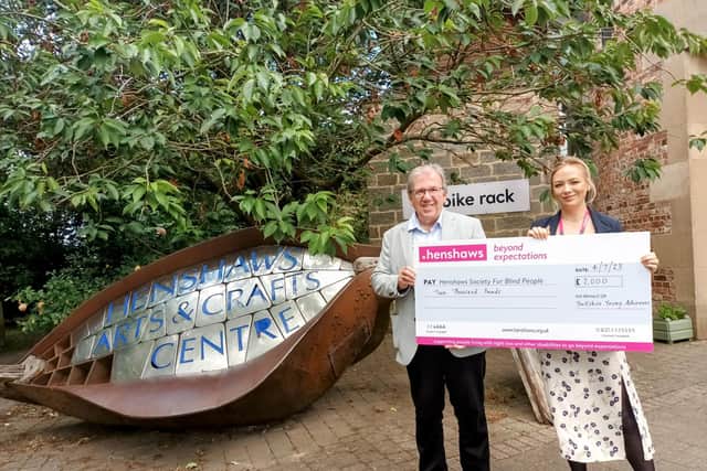 Yorkshire Young Achievers Foundation grant for Henshaws Arts and Crafts Centre in Knaresborough which works with disabled people - Here Foundation Trustee Martin Gerrard presents a cheque to Flora Simpson, Senior Fundraiser at Henshaws. (Picture contributed)