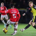 Dean Cornelius slots home Harrogate Town's first goal during Tuesday night's 2-2 draw at home to Wrexham. Pictures: Matt Kirkham