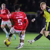Dean Cornelius slots home Harrogate Town's first goal during Tuesday night's 2-2 draw at home to Wrexham. Pictures: Matt Kirkham