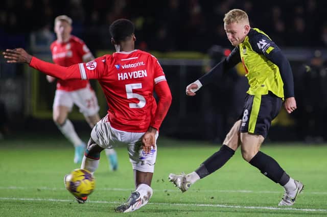 Dean Cornelius slots home Harrogate Town's first goal during Tuesday night's 2-2 draw at home to Wrexham. Pictures: Matt Kirkham
