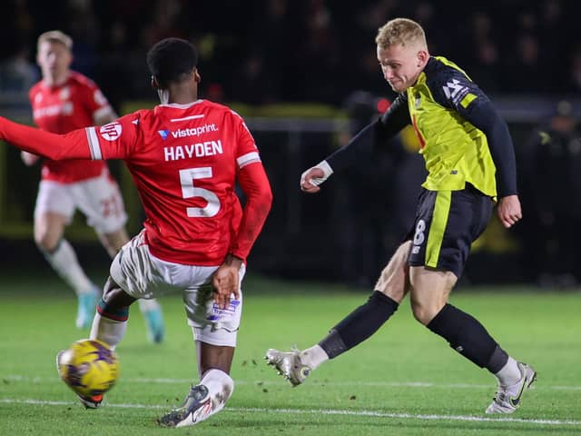 Dean Cornelius slots home Harrogate Town's first goal during Tuesday night's 2-2 draw at home to Wrexham. Pictures: Matt Kirkham
