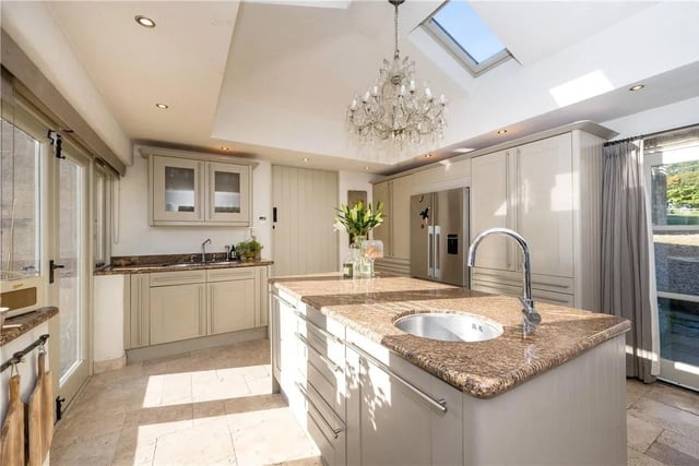 There is a large dining kitchen that forms the centrepiece of this charming house