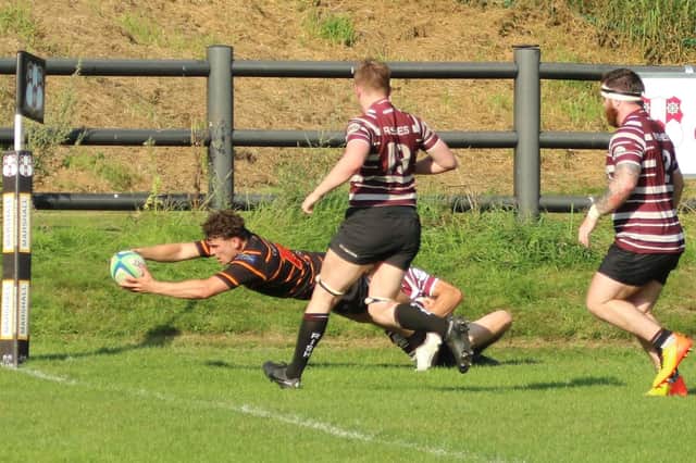 Harrogate Pythons winger Saul Adshead dives over the try-line during his side's Yorkshire One defeat at Old Rishworthian. Picture: Submitted