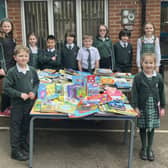 Brackenfield School Community Captains and School Council stand next to donated books.