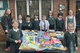 Brackenfield School Community Captains and School Council stand next to donated books.