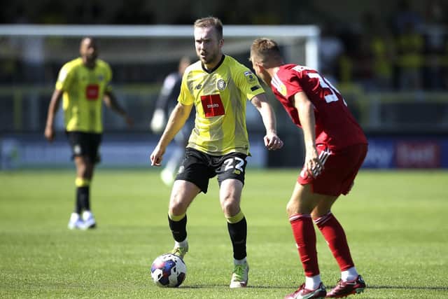 Stephen Dooley gets on the ball during Harrogate Town's League Two clash with Crawley at the EnviroVent Stadium.