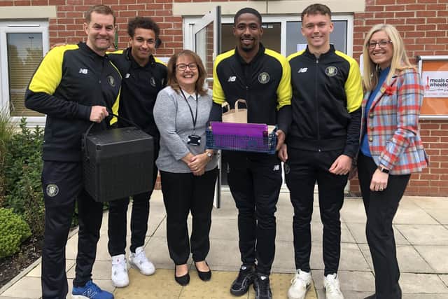 From left to right: Simon Weaver( Harrogate Town AFC Manager), Lewis Richards, Sue Cawthray (CEO of Harrogate Neighbours), Kayne Ramsey, George Horbury and Sarah Barry (CEO of Harrogate Town AFC)