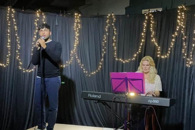 Rohan Johar (left) and Angeline Johns Bjerregaard (right) performing at Roosters Brewery and Taproom